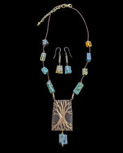 bronze tree & roman glass set